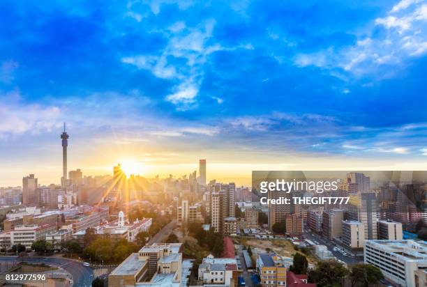 johannesburg sunrise sunflare cityscape - gauteng province stock pictures, royalty-free photos & images