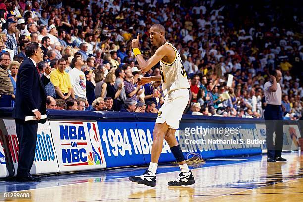 Reggie Miller of the Indiana Pacers points his finger in Game Four of the Eastern Conference Finals against the New York Knicks during the 1994 NBA...