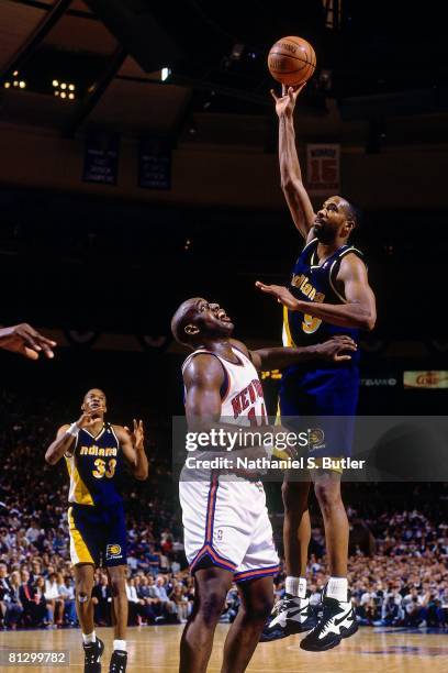 Derrick McKey of the Indiana Pacers shoots over Anthony Mason of the New York Knicks in Game Five of the Eastern Conference Finals during the 1994...