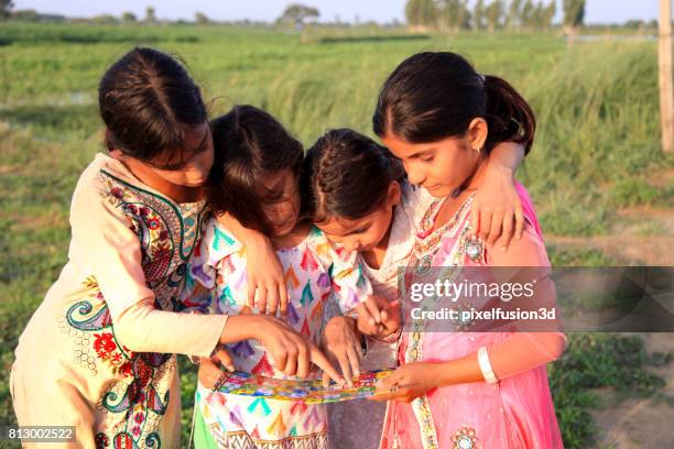 children playing ludo - ludo stock pictures, royalty-free photos & images