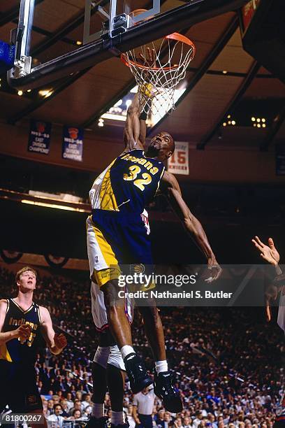 Dale Davis of the Indiana Pacers dunks against the New York Knicks in Game Five of the Eastern Conference Finals during the 1994 NBA Playoffs at...