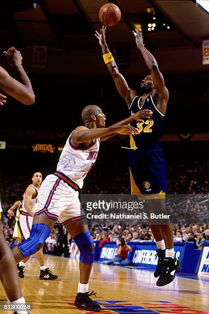 Dale Davis of the Indiana Pacers shoots over against Charles Smith of the New York Knicks in Game Five of the Eastern Conference Finals during the...