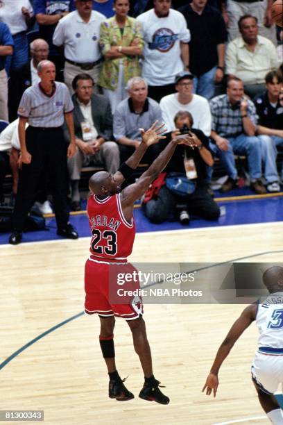 Michael Jordan of the Chicago Bulls shoots the game winning jumpshot against the Utah Jazz during game six of the 1998 NBA Finals at the Delta Center...