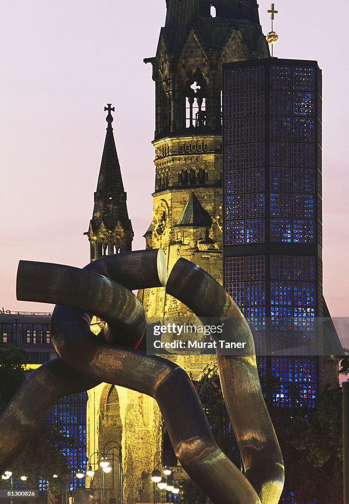 Kaiser Wilhelm Memorial Church (Gedachtniskirche) and modern sculpture. Berlin, Germany