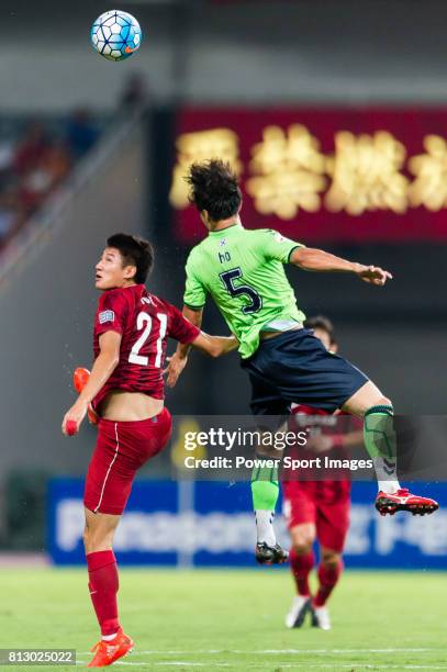 Shanghai SIPG FC forward Yu Hai fights for the ball with Jeonbuk Hyundai Motors FC midfielder Lee Ho during the AFC Champions League 2016 Quarter...