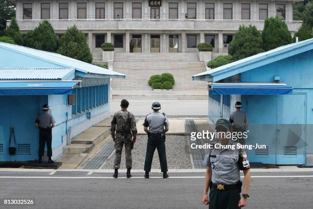 South Korean soldiers stand guard at the border village of Panmunjom between South and North Korea at the Demilitarized Zone on July 12, 2017 in...