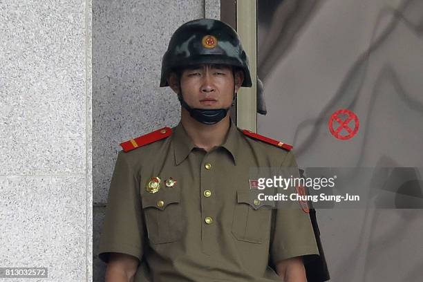 North Korean soldier looks at South Korea across the Korean Demilitarized Zone on July 12, 2017 in Panmunjom, South Korea. South Korea, Japan and the...