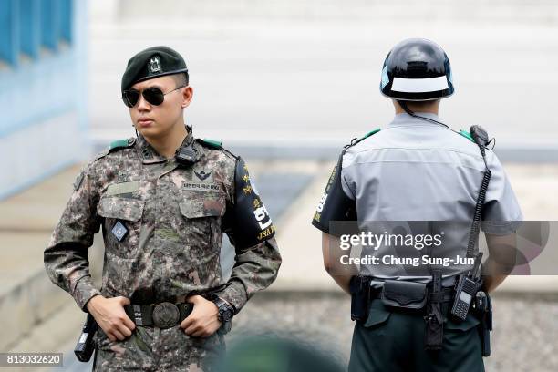 South Korean soldiers stand guard at the border village of Panmunjom between South and North Korea at the Demilitarized Zone on July 12, 2017 in...