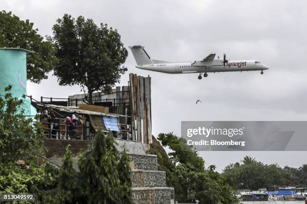 SpiceJet Ltd. Aircraft prepares to land at Chhatrapati Shivaji International Airport in Mumbai, India, on Monday, July 10, 2017. India, which was the...