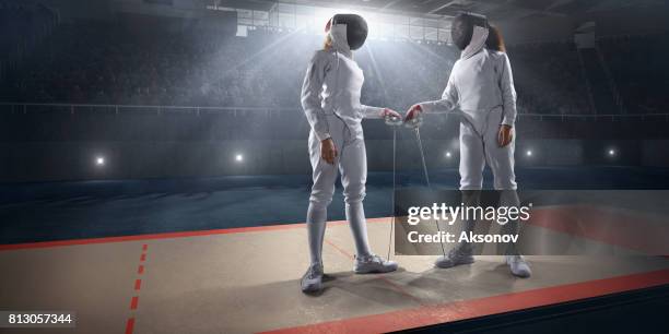 female fencer before the duel on big professional stage - mask confrontation stock pictures, royalty-free photos & images