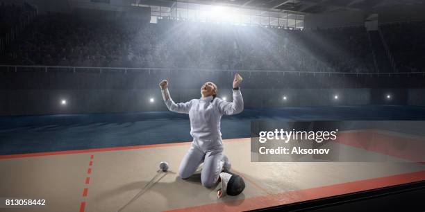female fencer emotionally rejoices victory on the big professional stage - mask confrontation stock pictures, royalty-free photos & images