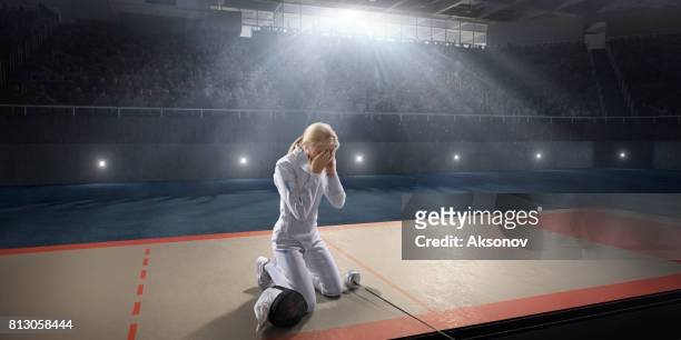 sad fencer on the big professional stage - athlete defeat stock pictures, royalty-free photos & images