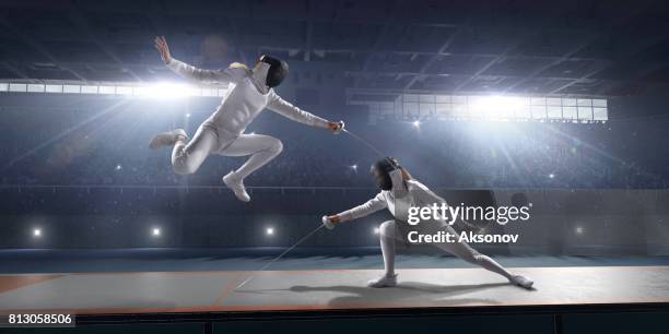 female fencer fight on big professional stage - mask confrontation stock pictures, royalty-free photos & images