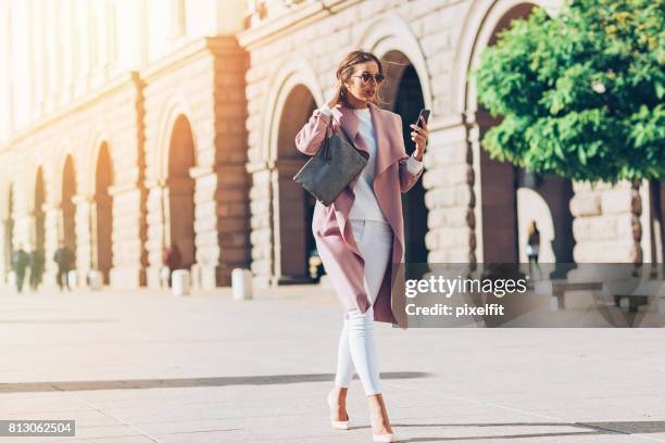 businesswoman in a hurry - designer bag stock pictures, royalty-free photos & images