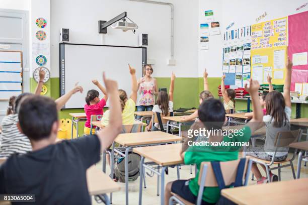 school kids in classroom - catalan stock pictures, royalty-free photos & images
