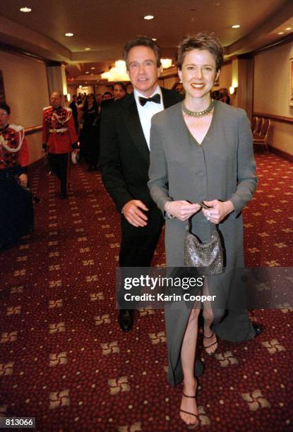 Actors Warren Beatty and his wife, actress Annette Bening, arrive for the annual White House Correspondents Association Dinner at the Washington...