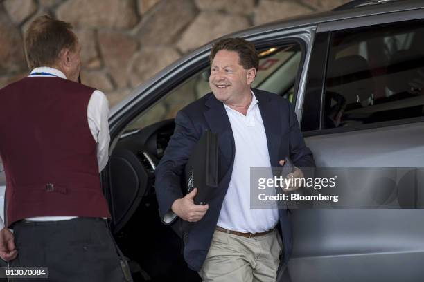 Robert Kotick, president and chief executive officer of Activision Blizzard Inc., right, arrives for the Allen & Co. Media and Technology Conference...