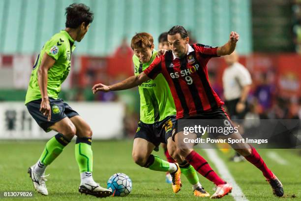 Seoul forward Dejan Damjanovic fights for the ball with Jeonbuk Hyundai Motors FC midfielder Kim Bo Kyung during the AFC Champions League 2016 Semi...
