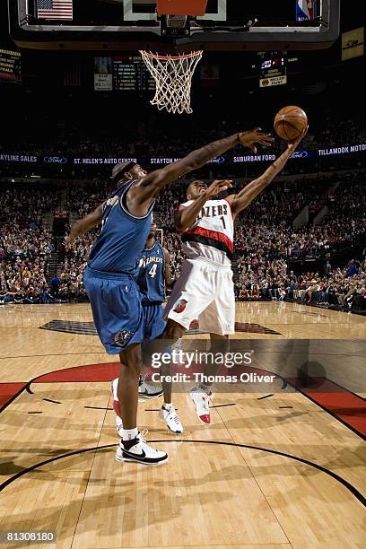 Jarrett Jack of the Portland Trail Blazers shoots a layup against Brendan Haywood of the Washington Wizards during a game at the Rose Garden Arena on...