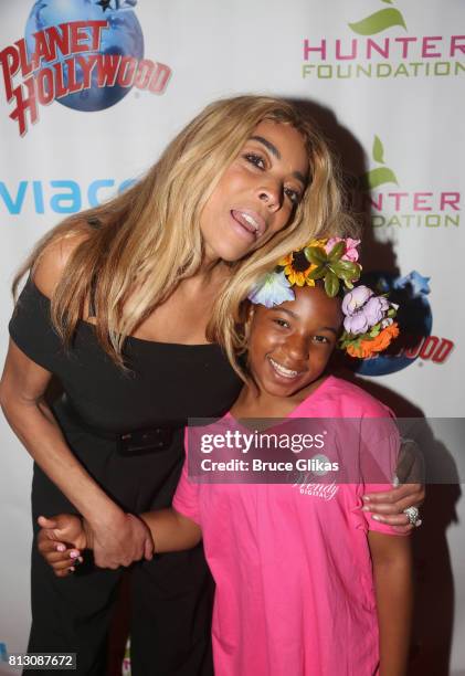 Wendy Williams and guests pose at a celebration for her Hunter Foundation Charity that helps fund programs for families and youth communities in need...