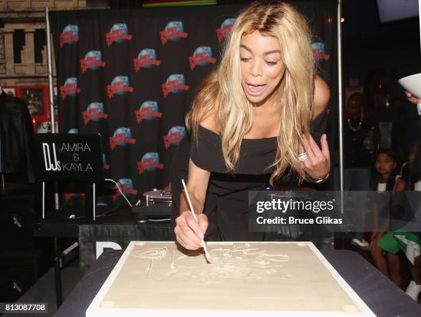 Wendy Williams gets immortalized with her handprints on the wall of fame at Planet Hollywod during a celebration for her Hunter Foundation Charity...