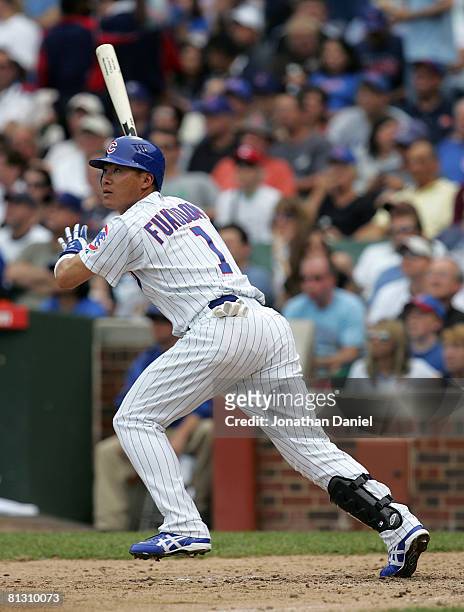 Kosuke Fukudome of the Chicago Cubs watches the flight of his two-run home run in the 6th inning against the Colorado Rockies on May 30, 2008 at...