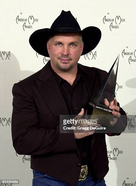 Garth Brooks poses for photographers at the 29th Annual American Music Awards at the Shrine Auditorium in Los Angeles.