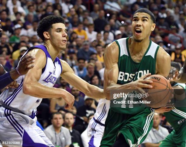 Jayson Tatum of the Boston Celtics drives against Lonzo Ball of the Los Angeles Lakers during the 2017 Summer League at the Thomas & Mack Center on...