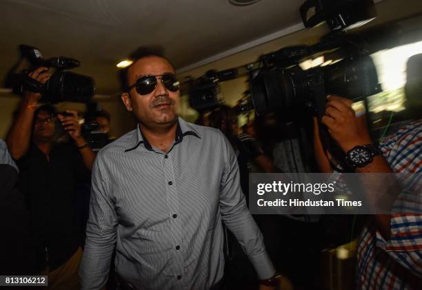 Former Indian cricketer Virender Sehwag arrives for a press conference for Indian cricket team coach at BCCI headquarters, on July 10, 2017 in...
