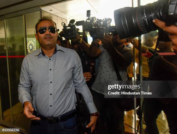 Former Indian cricketer Virender Sehwag arrives for a press conference for Indian cricket team coach at BCCI headquarters, on July 10, 2017 in...