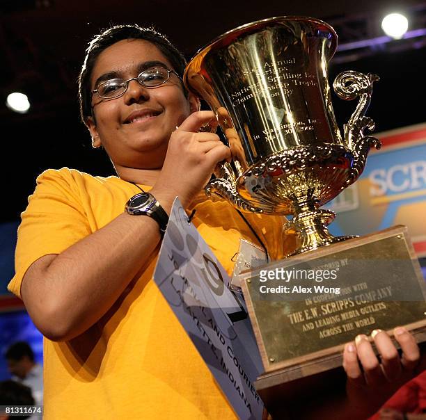 Sameer Mishra of West Lafayette, Indiana, holds up his winning trophy in the 2008 Scripps National Spelling Bee at the Grand Hyatt Washington Hotel...