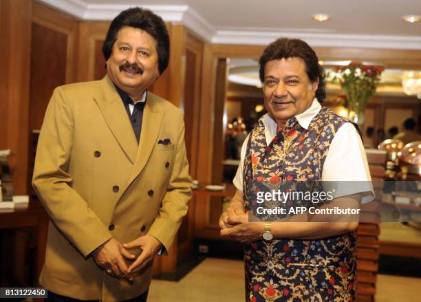 Indian Ghazal singers Pankaj Udhas and Anup Jalota attend a press conference for the "Khazana Ghazal Festival 2017" in Mumbai on July 12, 2017. / AFP...
