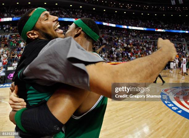 Paul Pierce and Eddie House of the Boston Celtics celebrate after defeating the Detroit Pistons to advance to the NBA Finals after Game Six of the...