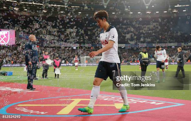 Son Heung-Min and Dele Alli dejectedly walk off after the defeat during the West Ham United v Tottenham Hotspur F.A. Premier League match at the...