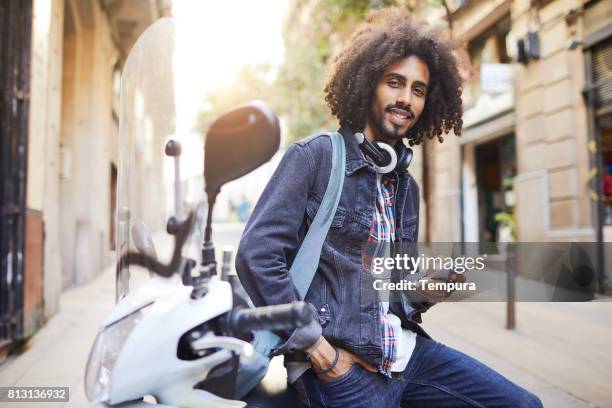 young trendy man in barcelona. - man with scooter stock pictures, royalty-free photos & images