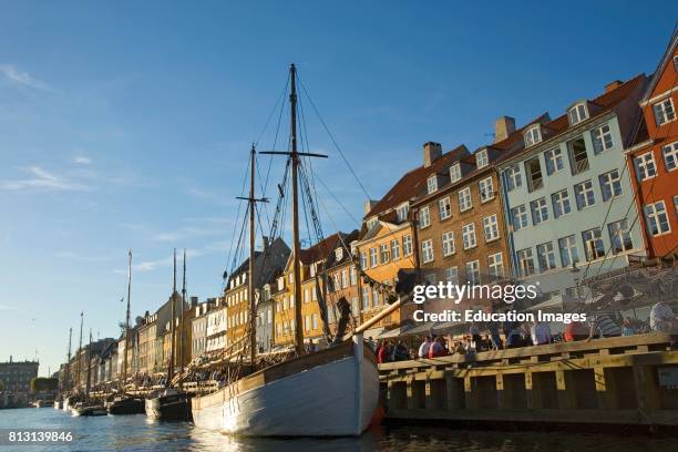 Copenhagen, Denmark. Typical architecture and boats at Nyhavn canal. Nyhavn, the New Port, was established in the 1670's by King Christian V. Many of...