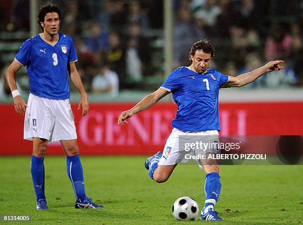 Italy's striker Alessandro Del Piero kicks a penalty as Italy's defender Fabio Grosso looks on during an Italy vs Belgium friendly football match at...