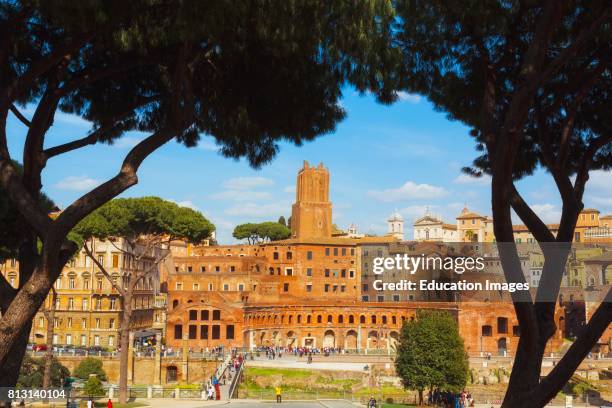 Rome, Italy. Trajan's Forum and market dating from the second century AD, at dusk. The tower, center, is the 13th century Torre delle Milizie. It has...