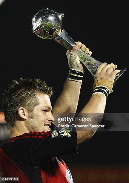 Crusaders captain Richie McCaw holds the trophy aloft after winning the Super 14 final match between the Crusaders and the New South Wales Waratahs...