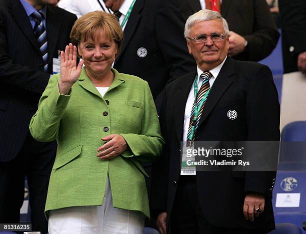German Chancellor Angela Merkel and German Football Association President Theo Zwanziger look on from the stands prior to the German international...