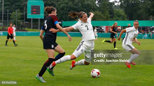 Dina Orschmann of Germany challenges Tierna Davidson of USA during the international friendly match between U19 Women's Germany and U19 Women's USA...