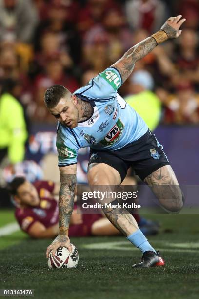 Josh Dugan of the Blues scores a try during game three of the State Of Origin series between the Queensland Maroons and the New South Wales Blues at...