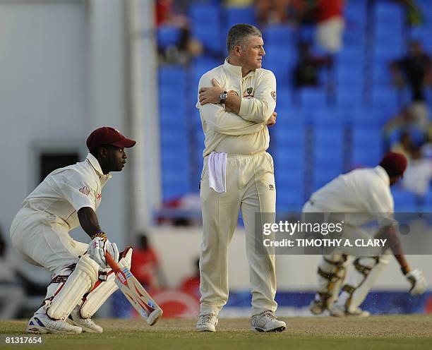 Australian bowler Stuart MacGill watches as West Indies captain Ramnaresh Sarwan and Xavier Marshall score runs in the 2nd innings during the 2008...