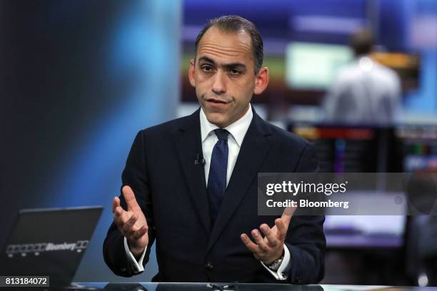 Harris Georgiades, Cyprus finance minister, gestures while speaking during a Bloomberg Television interview in London, U.K., on Wednesday, July 12,...