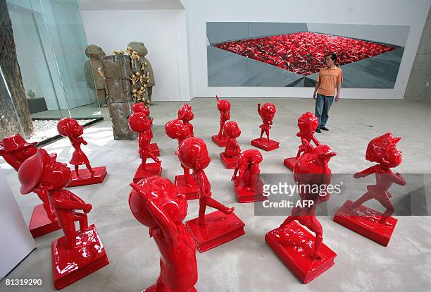 Man visits a gallery on May 25, 2008 in the 798 Art district of Beijing located in the Da Shan Zi area northeast of the Chinese capital. With fame,...