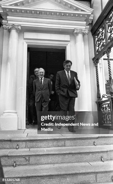 Acting Taoiseach Charles Haughey with Bertie Ahern and Joe Walsh leaving the Mansion House after talks with the Progressive Democrats, .