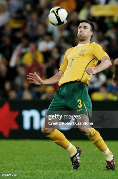 Michael Beauchamp of Australia controls the ball during the 2010 FIFA World Cup qualifying match between the Australian Socceroos and Iraq at Suncorp...