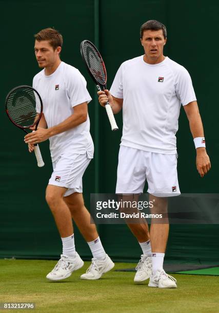 Ken Skupski of Great Britain and Neal Skupski of Great Britain look on during the Gentlemen's Doubles quarter final match against Lukasz Kubot of...