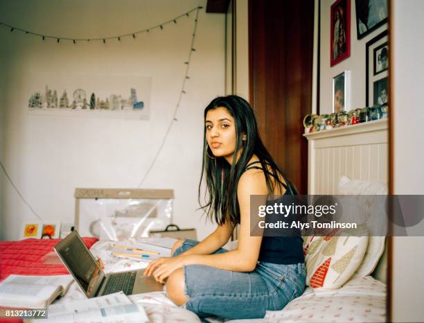 portrait of teenage girl in her bedroom - teenage girls stock pictures, royalty-free photos & images