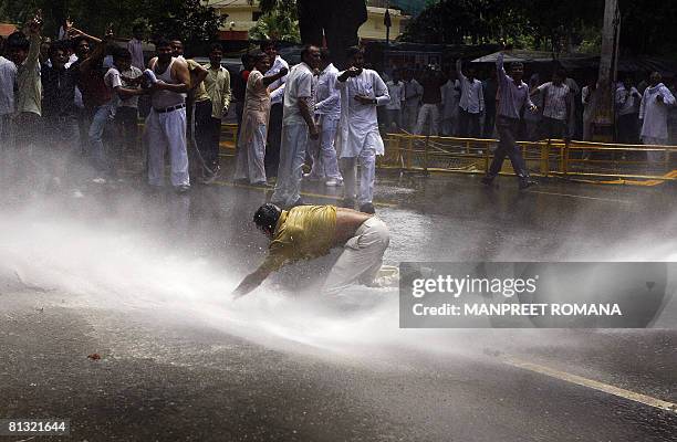 Indian police use a water canon to disperse Gujjar protesters during a protest in New Delhi on June 1, 2008. Agreeing to the demand of the Gujjars,...